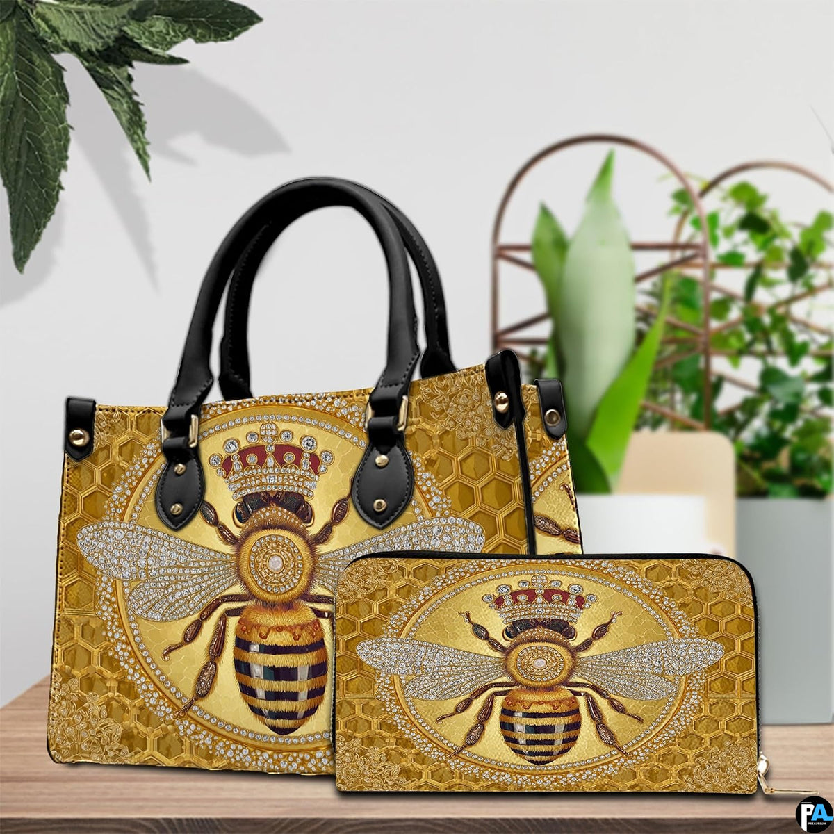 Side angle view of the crowned bee handbag displaying structured silhouette.