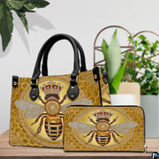 Side angle view of the crowned bee handbag displaying structured silhouette.
