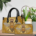 Side angle view of the crowned bee handbag displaying structured silhouette.