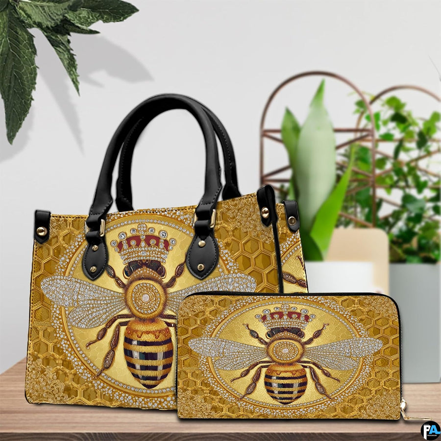 Side angle view of the crowned bee handbag displaying structured silhouette.