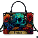 Stained glass mosaic skull handbag displayed alone on white studio background.