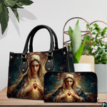Handbag and companion wallet with Virgin Mary devotional art displayed beside indoor greenery.