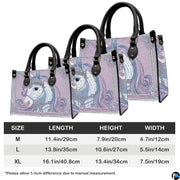 Back view of unicorn handbag displaying continuous lilac background with decorative border.