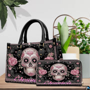 Front view of sugar skull handbag showing ornate pink calavera and blooming dusty roses.