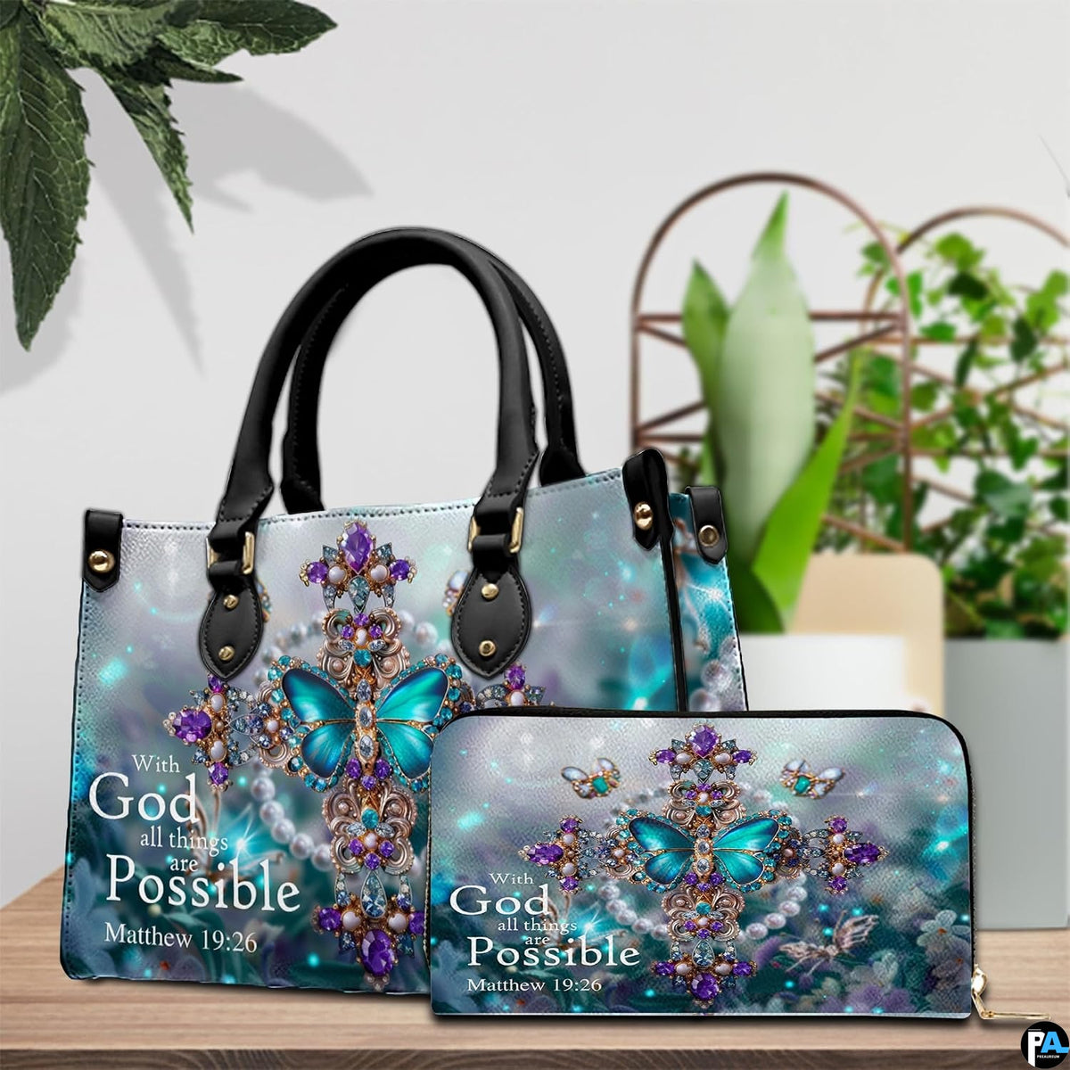 Front display of the jeweled cross handbag and matching zip wallet set on a wooden table