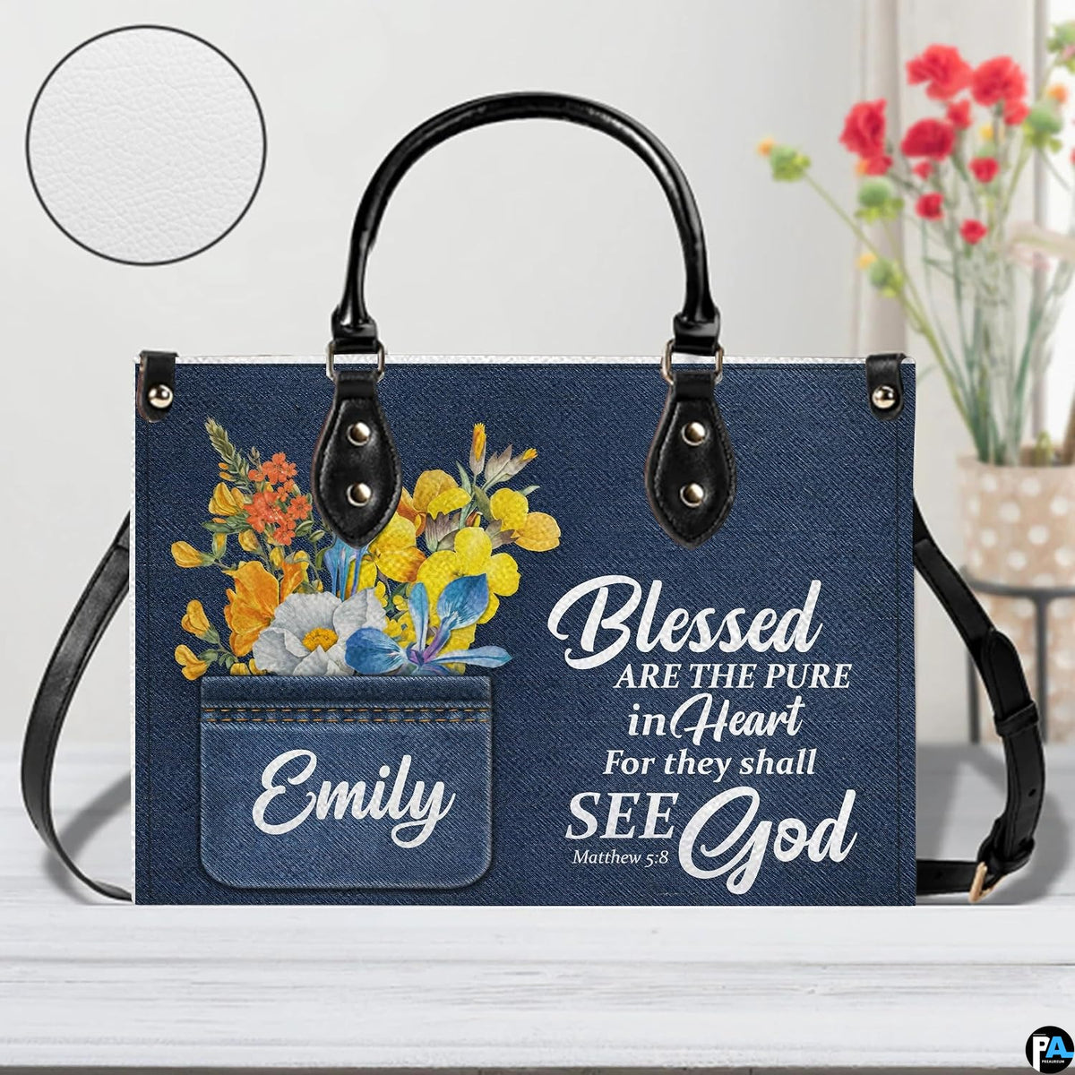 Side perspective view of scripture denim accessory on plain studio background