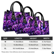 Side perspective view of purple butterfly handbag and wallet pair