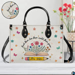 Handbag interior compartment arranged for daily personal and teaching essentials.
