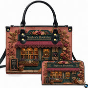 Vintage storefront facade framed by pink roses and burgundy awning on matching handbag and wallet set.