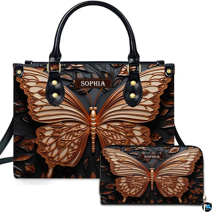 Handbag and matching wallet set featuring a sculpted bronze butterfly on dark carved ground.