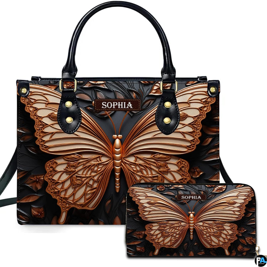 Handbag and matching wallet set featuring a sculpted bronze butterfly on dark carved ground.