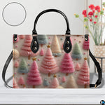 Close view highlighting textured pastel holiday trees and miniature gold star toppers