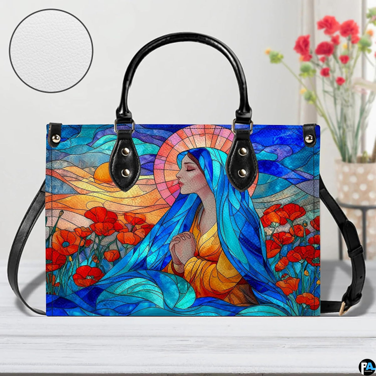 Stained glass Virgin Mary artistic print resting indoors on wooden tabletop.