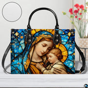 Model walking outdoors carrying sapphire stained glass Madonna handbag.