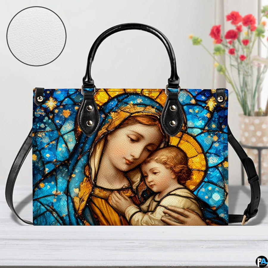 Model walking outdoors carrying sapphire stained glass Madonna handbag.