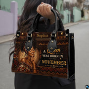 Model carrying regal African woman handbag with natural curls