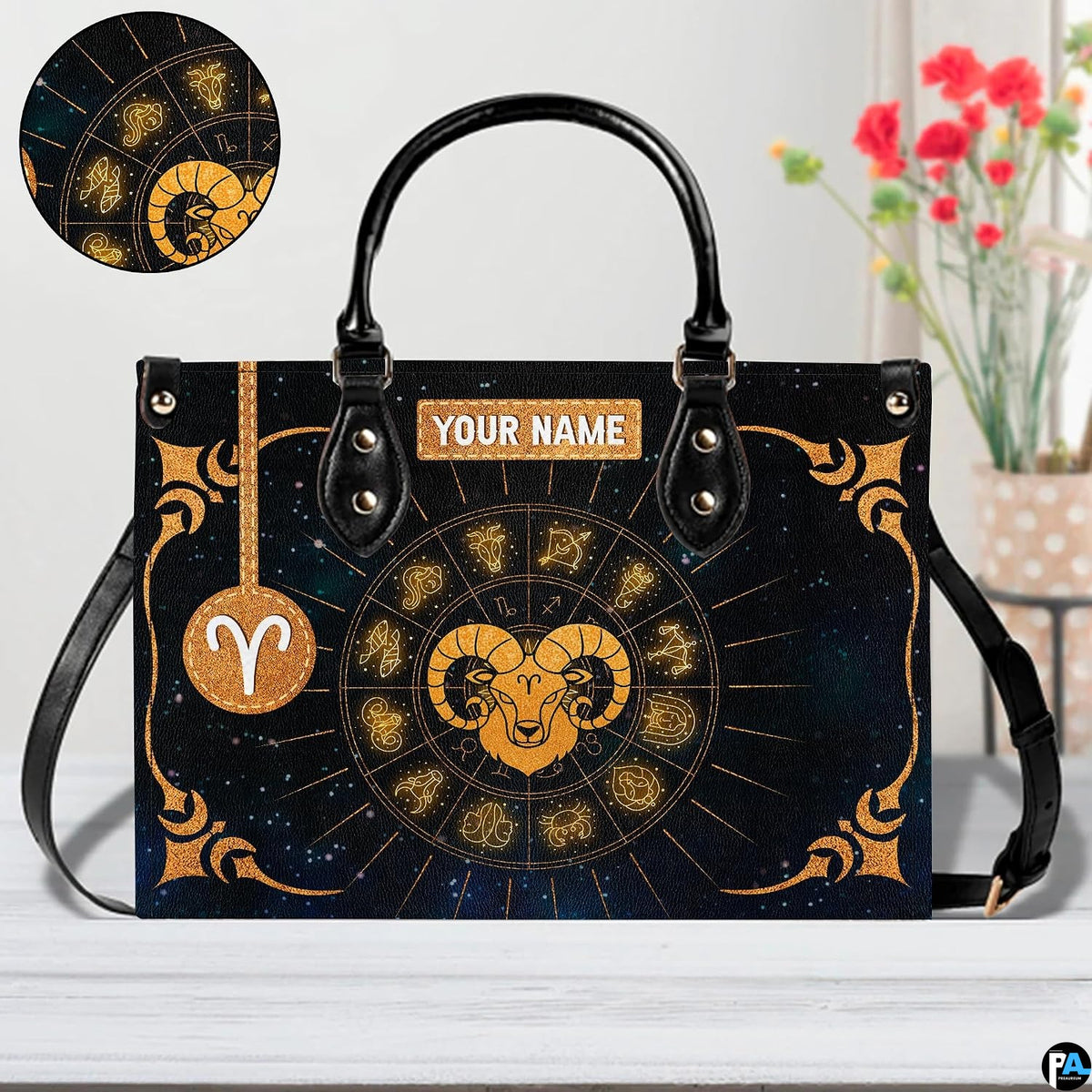 Angled perspective view of zodiac ram handbag highlighting radiating gold rays and corner filigree.