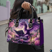 Outdoor lifestyle photo of model carrying whimsical reading dragon handbag.