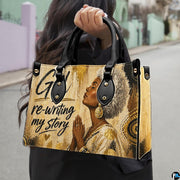 Outdoor presentation showing the spiritual woman artwork held by pedestrian walking along city sidewalk.