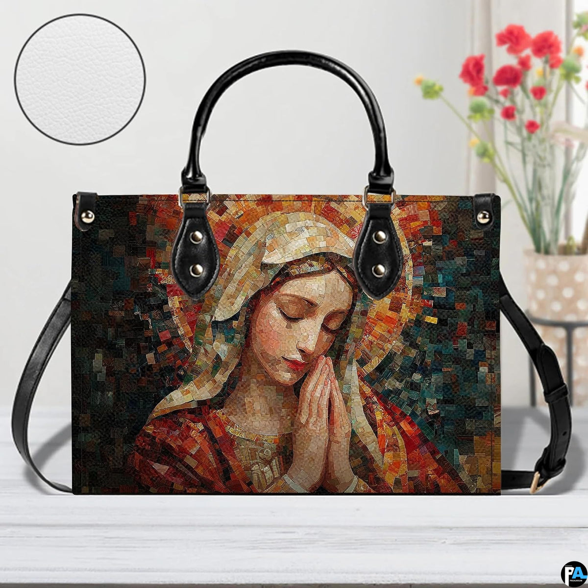 Studio staging of mosaic Praying Virgin Mary handbag with texture inset circle and flowers.