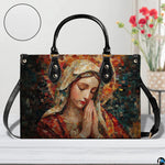 Studio staging of mosaic Praying Virgin Mary handbag with texture inset circle and flowers.