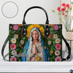 Detailed front view of Virgin Mary sunflower halo handbag with texture sample inset