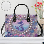 Interior compartment view of mermaid handbag showing inner lining and organization.