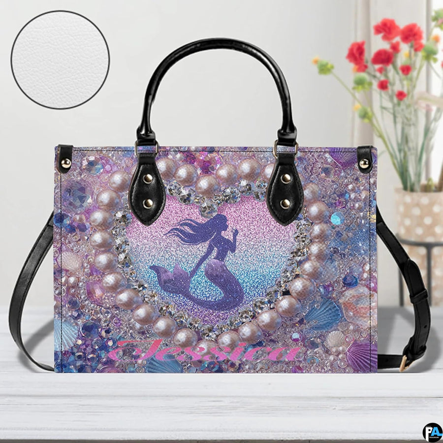 Interior compartment view of mermaid handbag showing inner lining and organization.