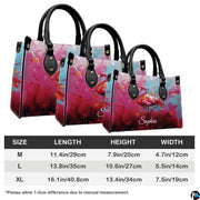 Angled display highlighting the vivid pink flamingo illustration and paint drip details.