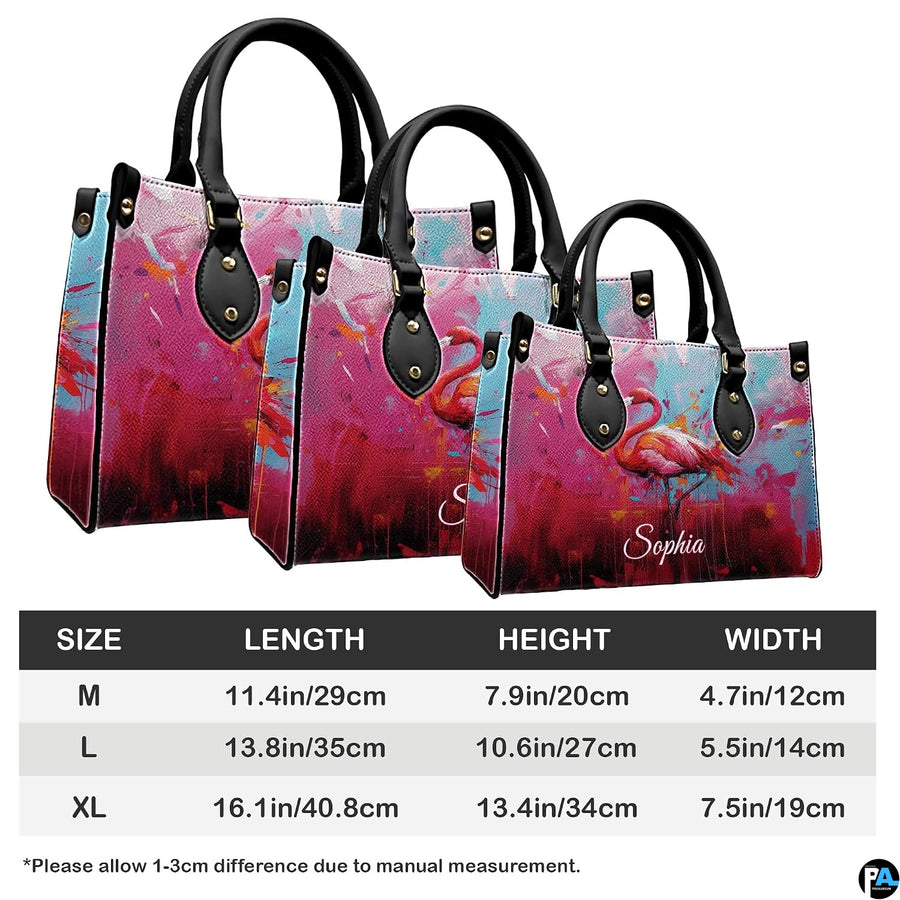 Angled display highlighting the vivid pink flamingo illustration and paint drip details.