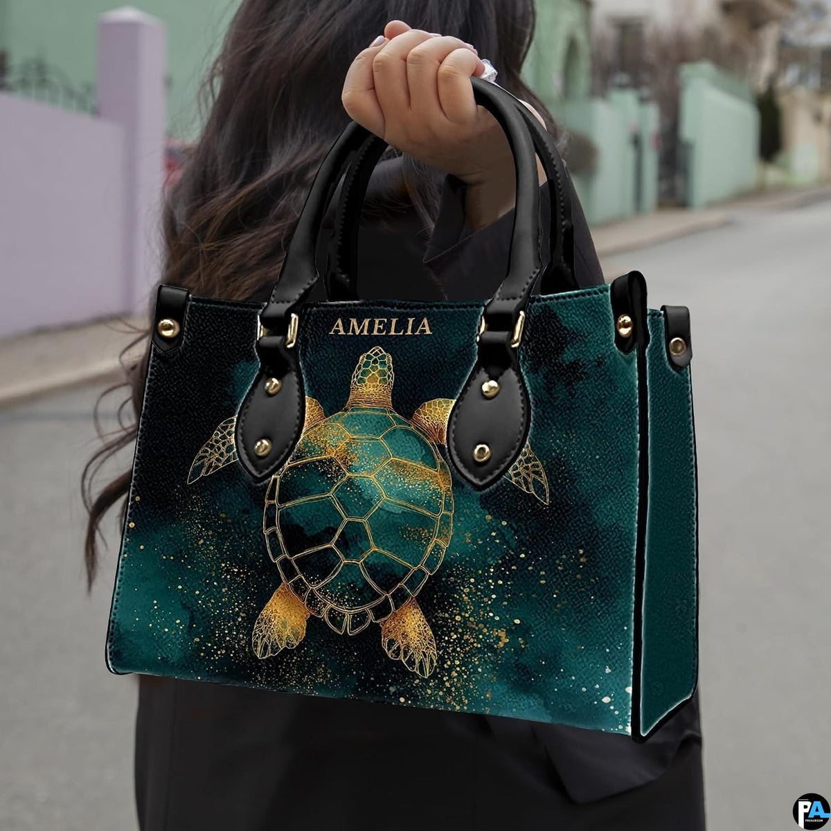 Front angled view displaying the ornate golden turtle illustration against deep emerald watercolor.