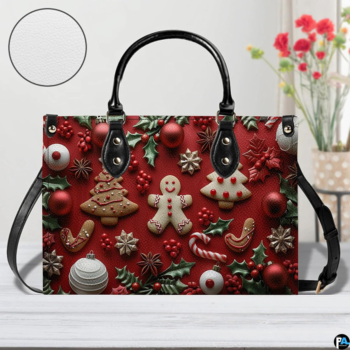 Model wearing Christmas gingerbread handbag over shoulder with attached strap.