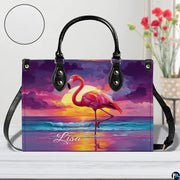 Street perspective of the colorful sunset flamingo shoulder bag.