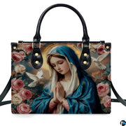 Front isolated view of Virgin Mary praying devotional handbag with rose artwork.