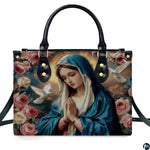 Front isolated view of Virgin Mary praying devotional handbag with rose artwork.