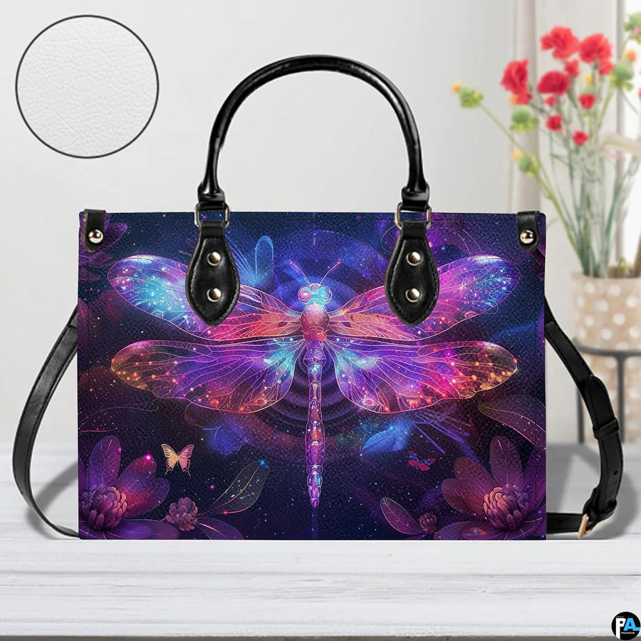 Bottom view of neon dragonfly handbag showing protective metal feet and structured base wrap