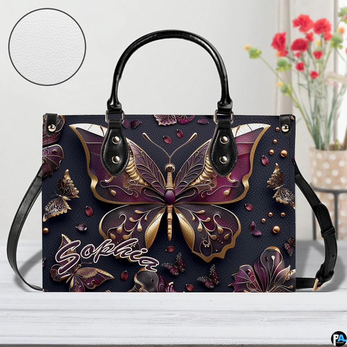 Close-up front view of matching zippered wallet showing gold butterfly