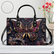 Close-up front view of matching zippered wallet showing gold butterfly