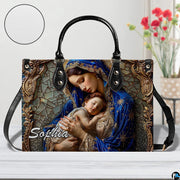 Madonna and sleeping infant motif accessory resting on table with circular texture graphic.