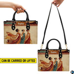 Carrying options diagram illustrating hand carry and shoulder strap carry on the African queen handbag.