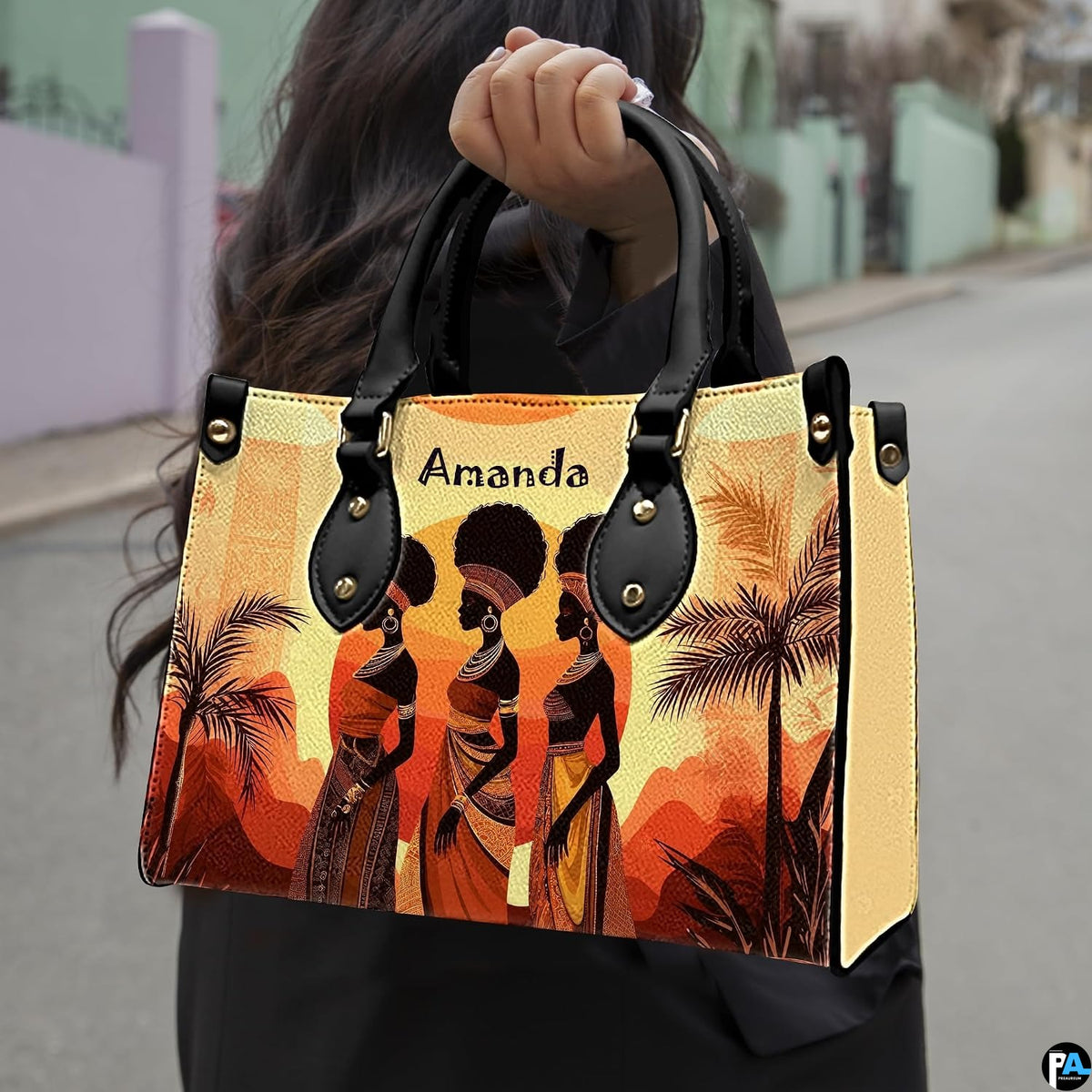 African landscape art prints presentation shown outdoors on a sunlit city pavement walkway.
