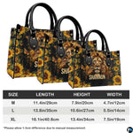Angled perspective view of lion cross handbag highlighting lion mane details and sunflower borders.