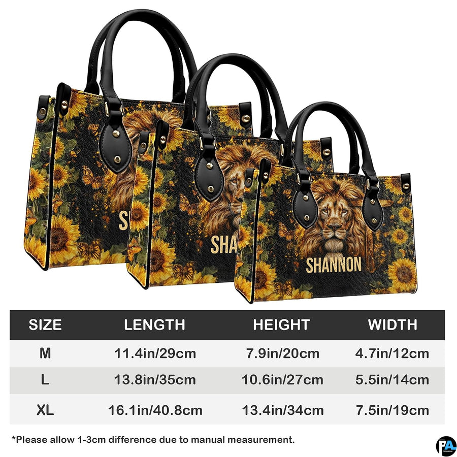 Angled perspective view of lion cross handbag highlighting lion mane details and sunflower borders.