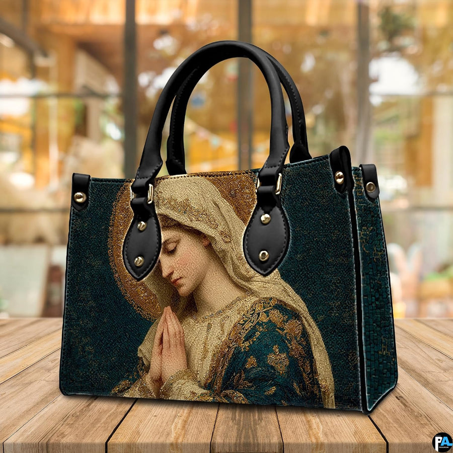Byzantine Mary handbag resting on an outdoor wooden table surface in front of a cafe window