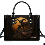 Gothic autumn witch broomstick handbag displayed alone on white background.
