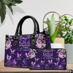 Side profile view of structured purple handbag showing sleek silhouette and black carrying handles.