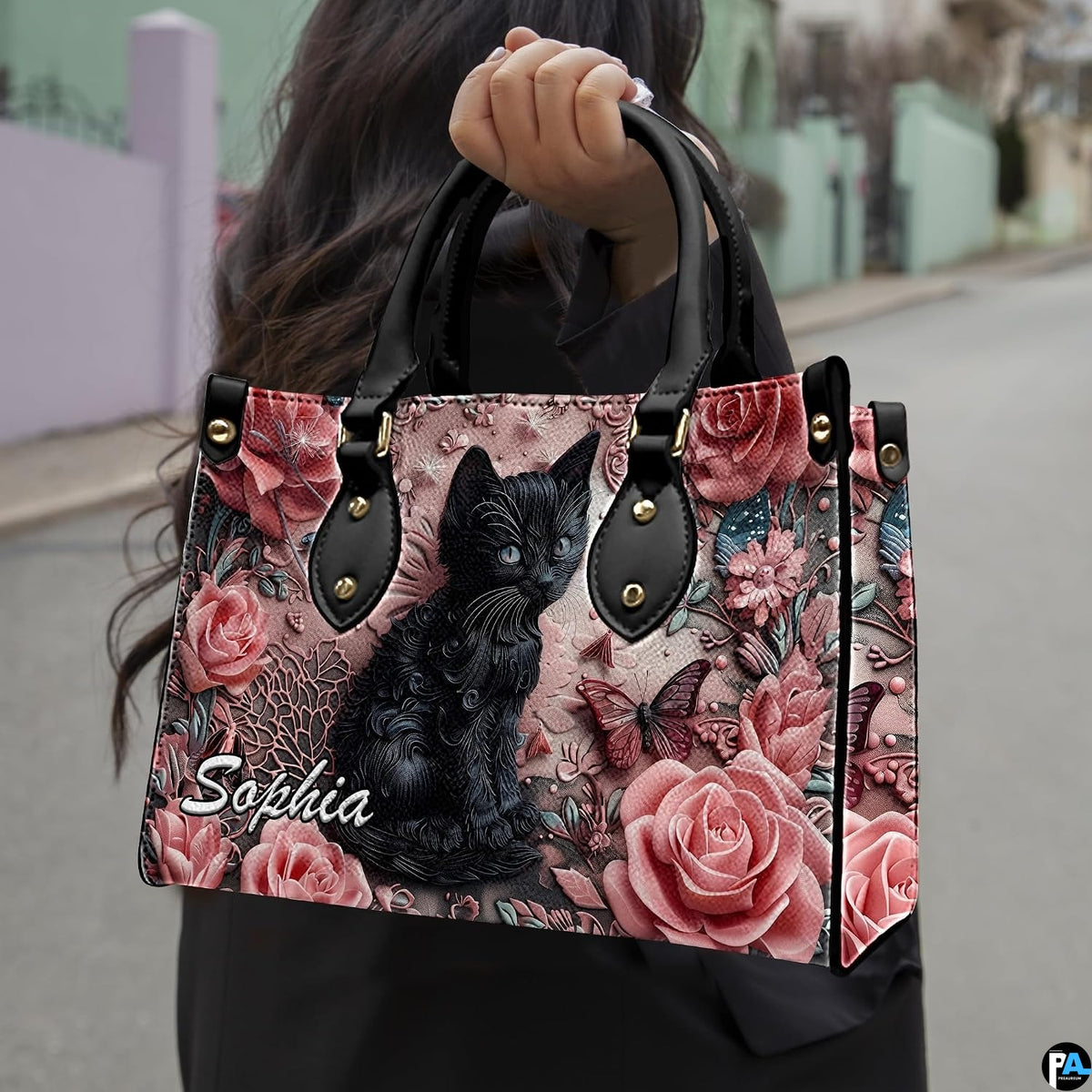 Outdoor model showcasing sculpted black cat and rose floral artwork.