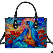 Studio front view of colorful stained glass praying Madonna artwork with poppy meadow.