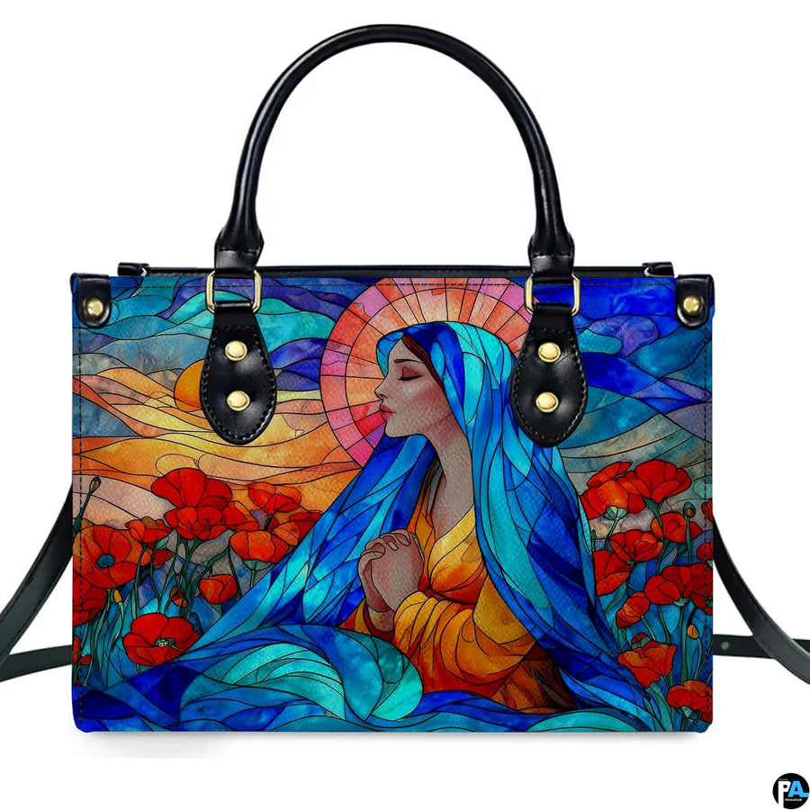 Studio front view of colorful stained glass praying Madonna artwork with poppy meadow.