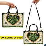 Clover heart handbag shown in handheld and shoulder presentations